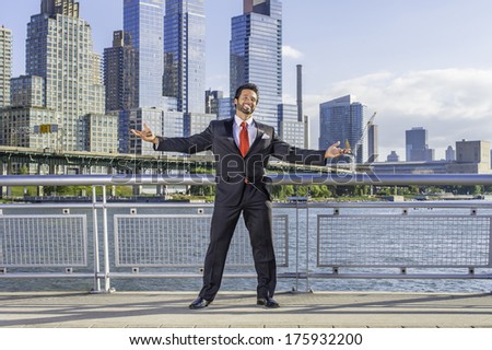 Dressing is a black suit and red tie, a handsome, sexy, middle age businessman with mustache and beard is stretching arms in a busy business district, confidently looking forward. / Welcome Home
