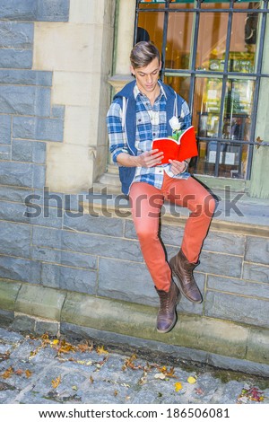 Man Reading Outside. Dressing in a blue and white pattern shirt,  a blue hood vest,  red jeans and brown leather boot shoes, a young guy is sitting by a window, reading a red book with a white flower.