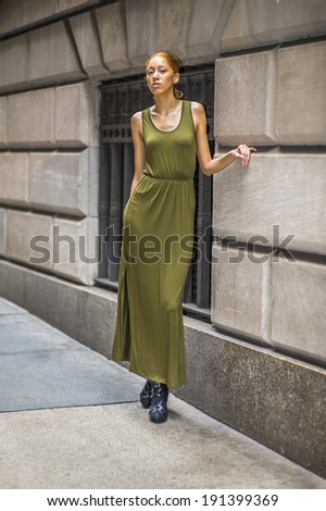 Girl Waiting For You. Dressing in a green, long Maxi Tank Dress,  black dress sandals, a young black woman is standing by old fashion style window and wall, passionately looking at you.