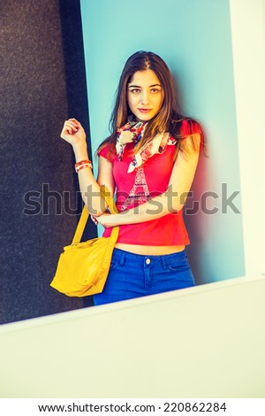 Woman Waiting for You. Wearing red short sleeve shirt, light weight scarf, blue pants, arm carrying a yellow leather hand bag, a beautiful lady standing in modern interior, thinking, lost in thought.