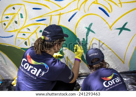 SAO PAULO, BRAZIL, December 03, 2014: task force paints the wall in Sao Paulo, Brazil