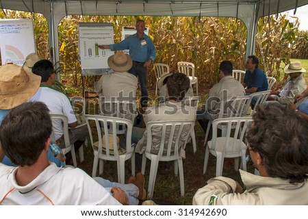 SANTA HELENA, GOIAS, BRAZIL, MARCH 05, 2009. Engineer agronomist teaches a technical training on seeds for improvement of employees and technicians in a research center in Goias State.
