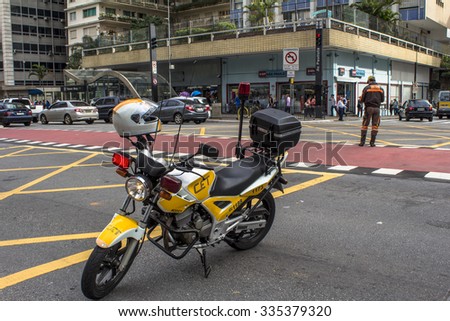 Sao Paulo, SP, Brazil, October 29, 2015. Motorcycle of CET, Traffic Engineering Company is blocking one of the lanes of Paulista Avenue, during the protest of teachers and students, in Sao Paulo
