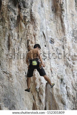 climbing on the rock route summer (Railay Beach, Krabi province Thailand).