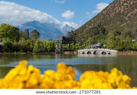 Lijiang old town scene-Black Dragon Pool Park. Jade Dragon Snow Mountain in the background.
