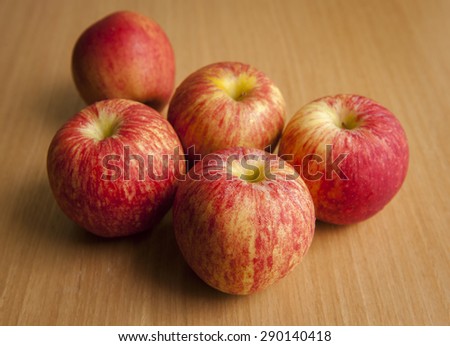 gala apples on wood table