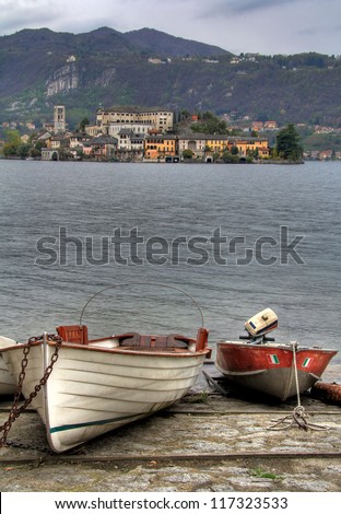 Famous San Giulio Island in Orta lake taken from the boat docks.
