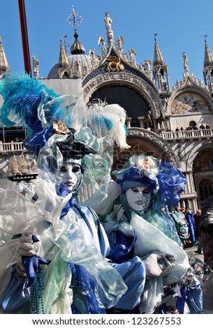 VENICE - FEBRUARY 17: Sea color couple during Carnival on February 17 , 2012 in Venice , Italy . Carnival of Venice 2012  focused on the Angel Flight , in Piazza San Marco in the day of 12 February.