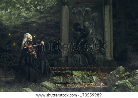 Gothic portrait of a dark lady playing a fiddle. Fantasy and halloween concept