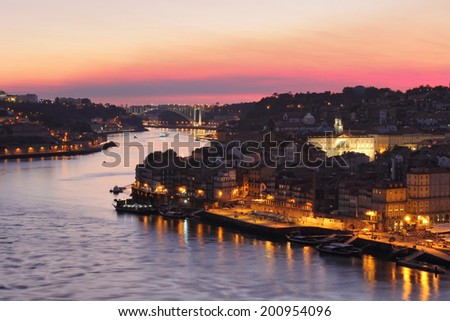 Beautiful Porto cityscape and Arrabida bridge in background.  Sunset  light .