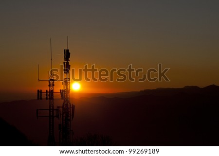 antennas to the light at sunset