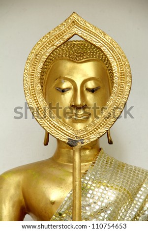 Buddha statue face gold talipot fan