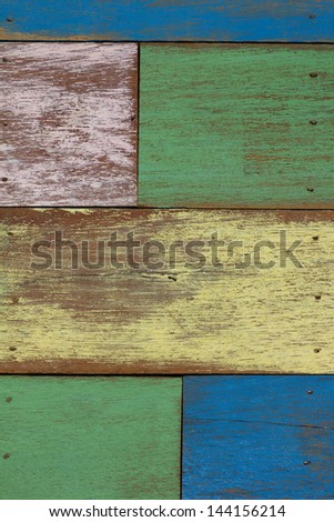 detail of abstract art color wood wall yellow green blue