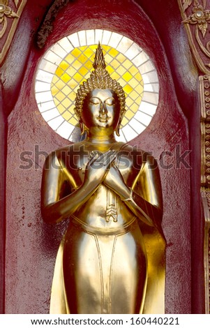 gold buddha statue mirror background reflection sun light