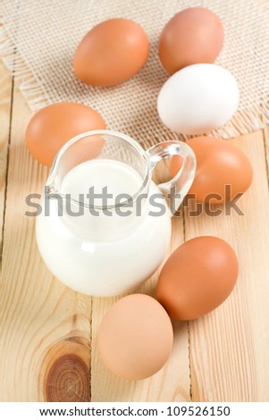 Jug with milk and eggs