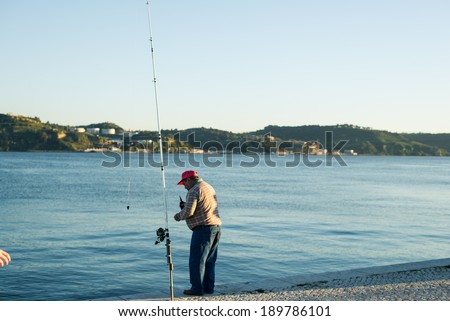 Lisbon, Portugal Ã¢Â?Â? April 07 2014: Man fishing on River Tagus in Lisbon.