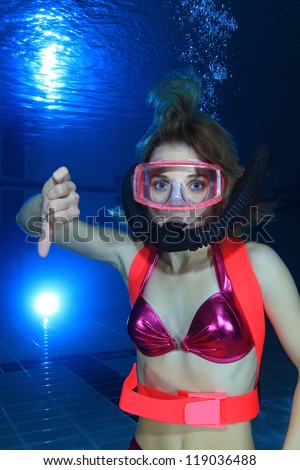 Female diver show hand signal