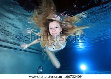 Female swimmer underwater in the pool
