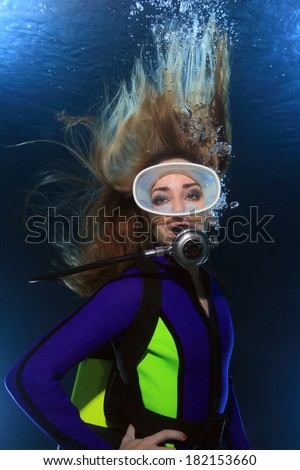 Scuba woman with long hair underwater