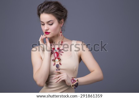 Portrait of beautiful brunette woman with handmade jewelry