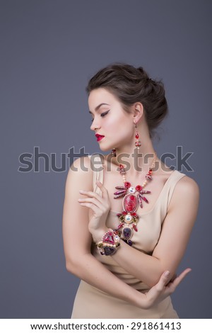 Portrait of beautiful brunette woman with handmade jewelry