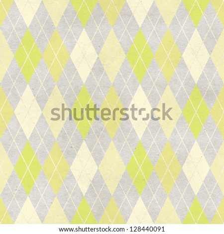 Seamless harlequin background on paper texture