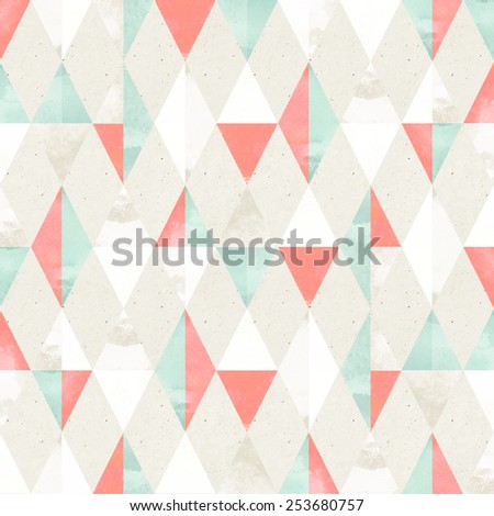 Seamless harlequin pattern on paper texture. Geometric background