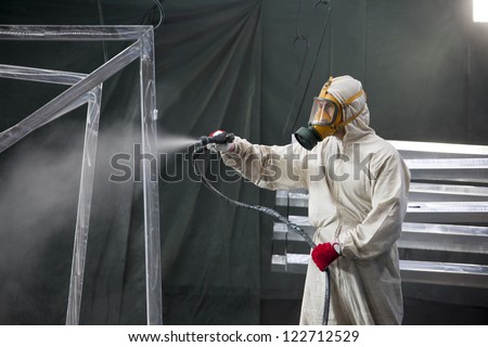 painter painting metal designs with airbrush painter painting metal designs with airbrush