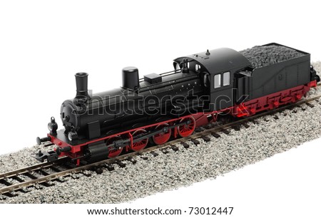 Miniature steam locomotive isolated over white background