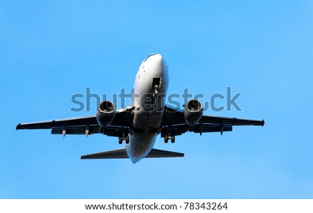 airplane landing on the blue sky background