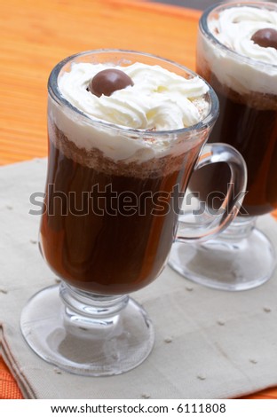 Closeup of two cups of coffee with cream (Caffe Borgia)