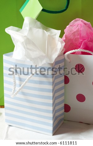 Three colorful gift bags next to each other