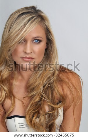 stock photo : Portrait of a beautiful blonde woman with light blue eyes and 