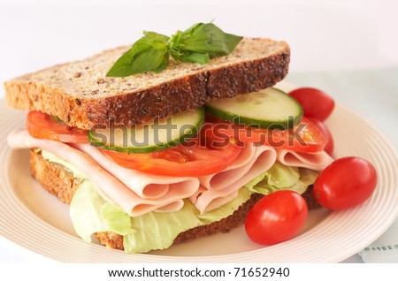 Tasty smoked ham, tomato and cucumber sandwich on wholewheat bread