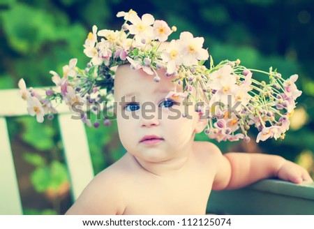 dreaming girl in the big flower garland