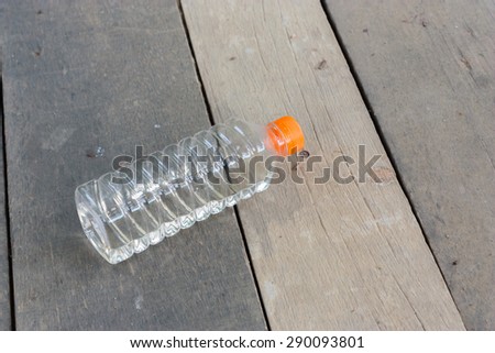plastic bottle no label on wood plate