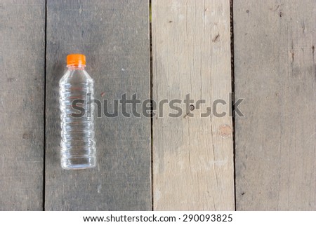 plastic bottle no label on wood plate