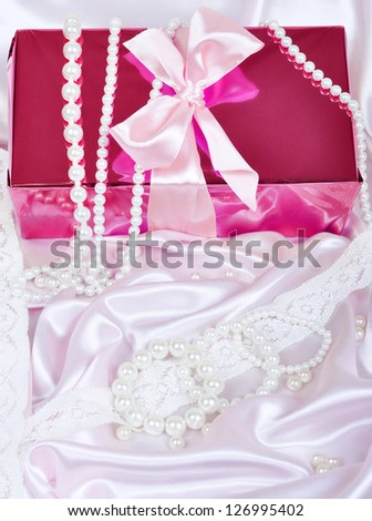 gift box on silk ribbon and pearls