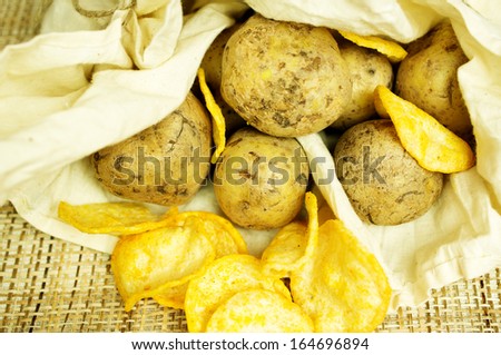 Natural potato chips in a package and potatoes in the bag