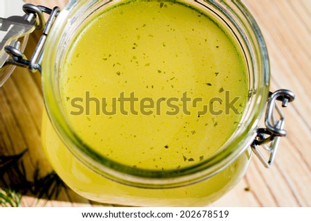 Canned broth, bouillon, clear soup in a glass jar