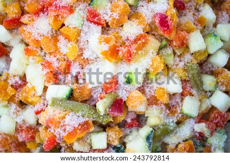 Frozen vegetables closeup colorful in hoarfrost