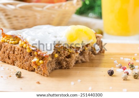 Piece bite sandwich with fried egg for breakfast