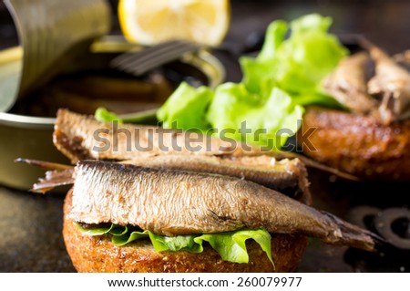 Tapas bun burger with smoked sardines or sprats