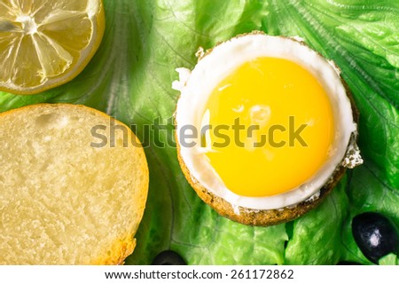 Tapas, appetizer burger bun with fried egg