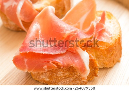 Hamon on a piece of toasted bread closeup