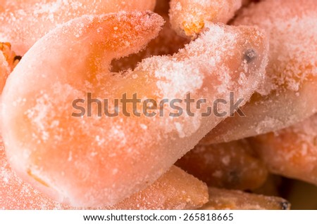 Shrimp covered with ice closeup on a background of frozen shrimp