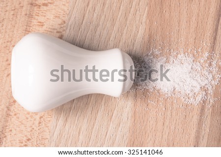 Salt shaker spill salt top view