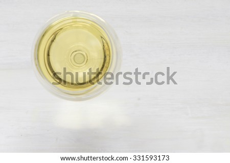 White wine glass on a white background top view