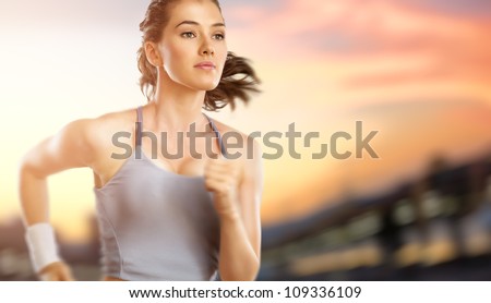 Girl In Sport On The Sunset Background
