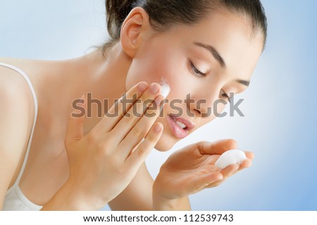 beautiful girl washes his face